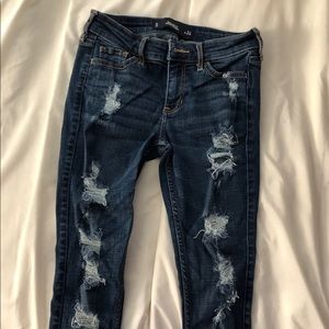 Navy blue ripped jeans